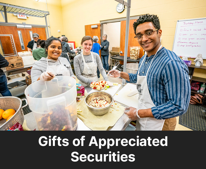 Students working in a cooking class. Links to Gifts of Appreciated Securities