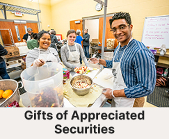 Students working in a cooking class. Links to Gifts of Appreciated Securities