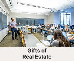 A professor teaching their class. Links to Gifts of Real Estate 