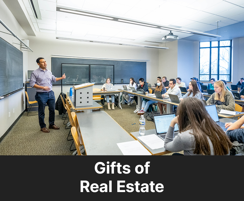 A professor teaching their class. Links to Gifts of Real Estate 